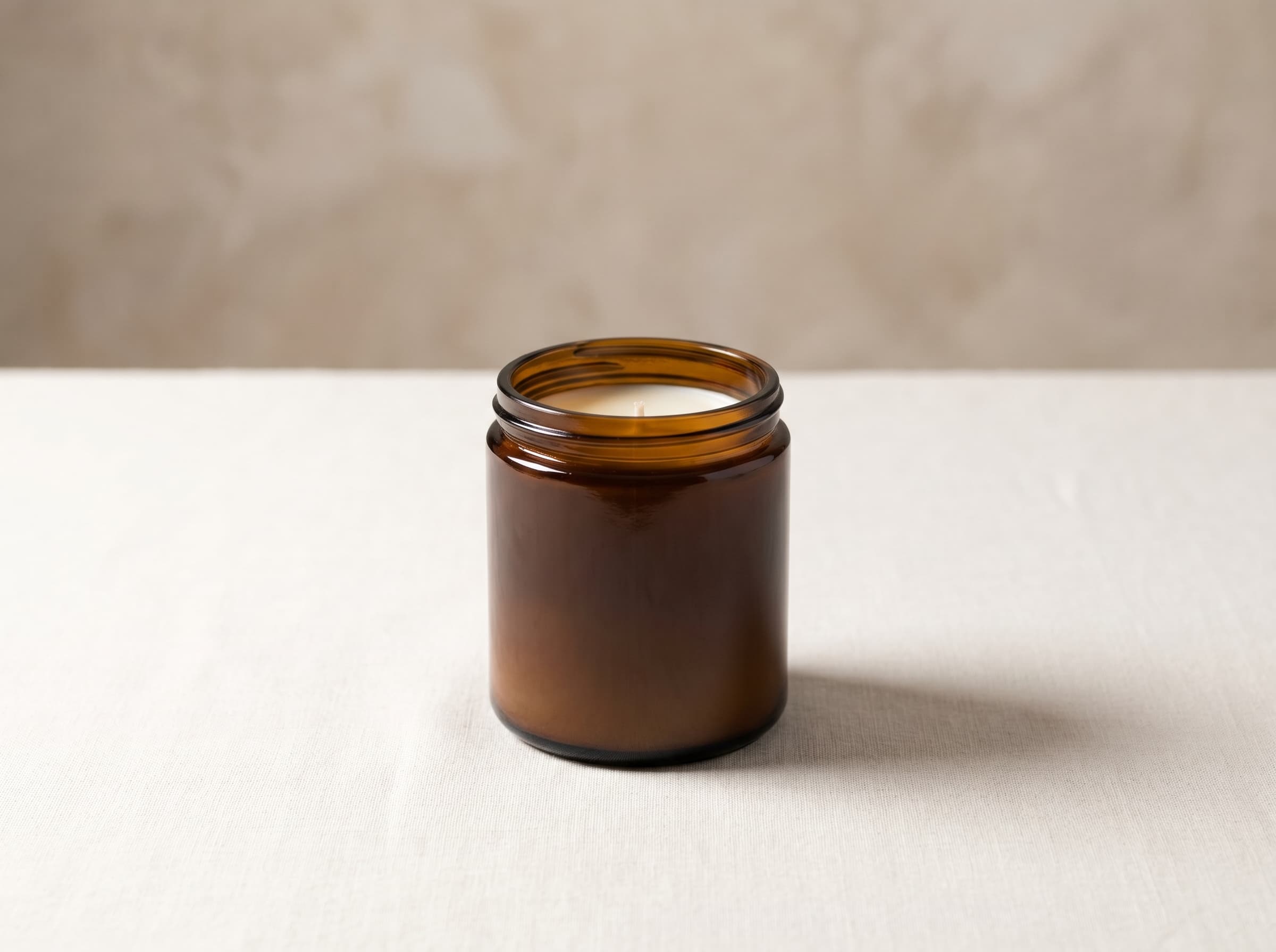 The Cravista Candle — charcoal stoneware porcelain vessel on a minimal surface