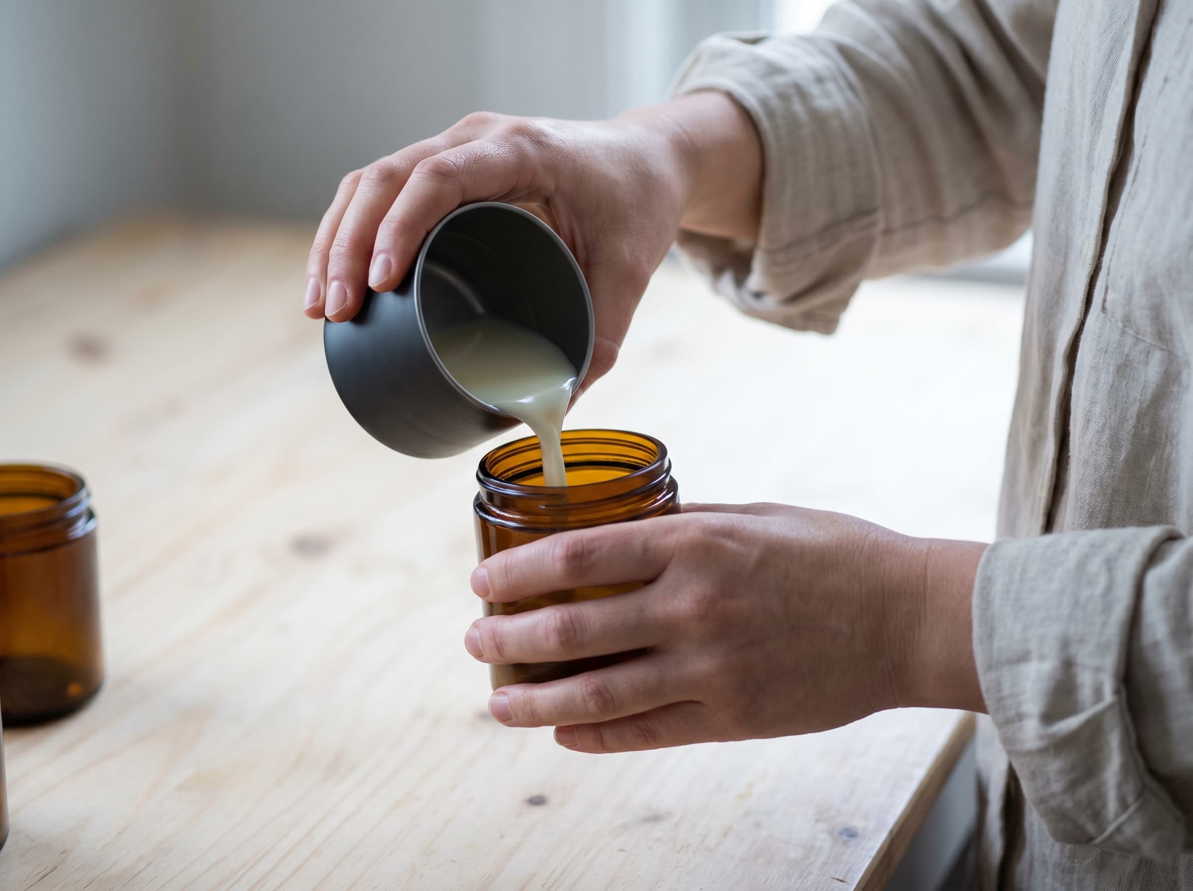 Studio hands working with fragrance materials